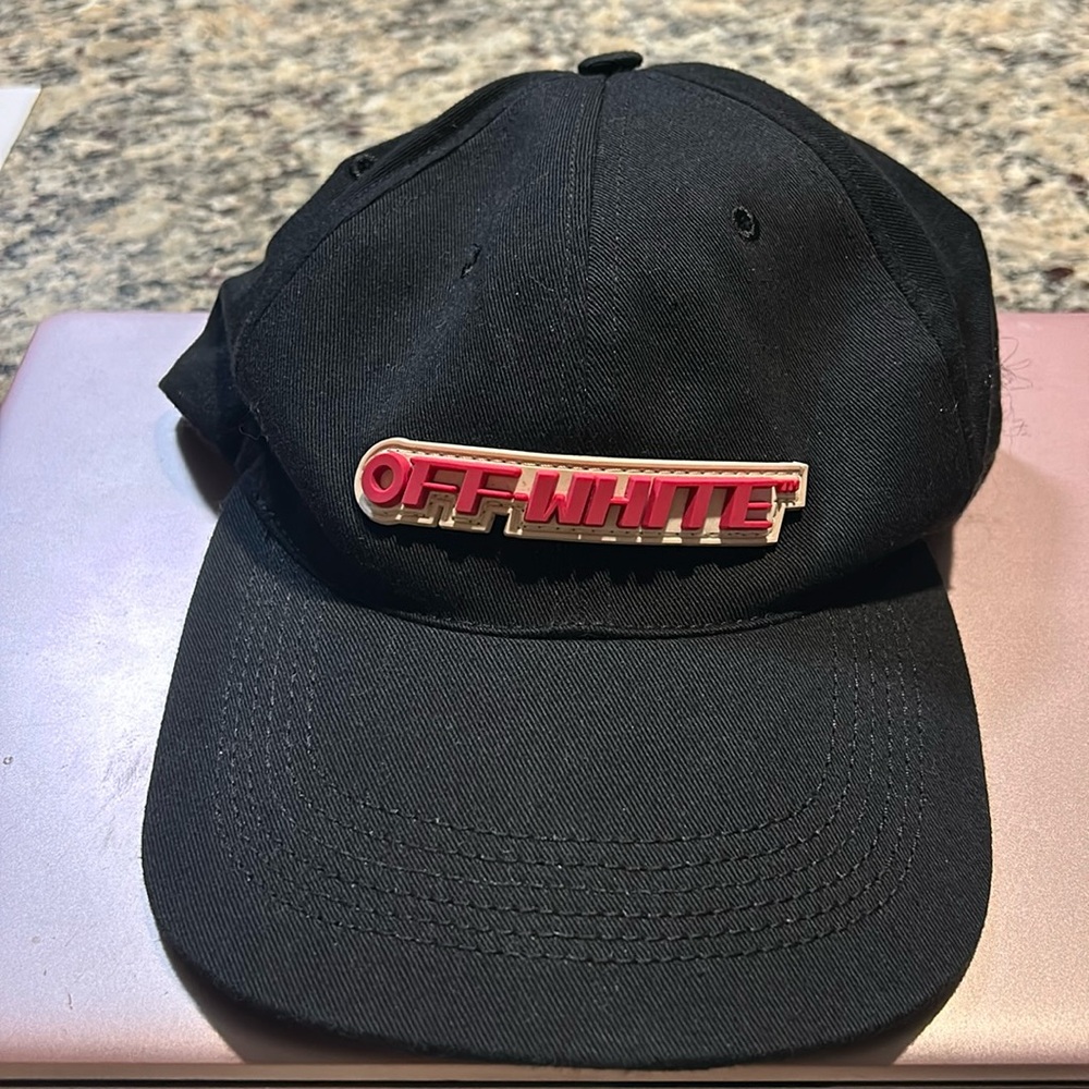 Off White soft cap with snap back. Never worn. O/S steal price. Black with logo